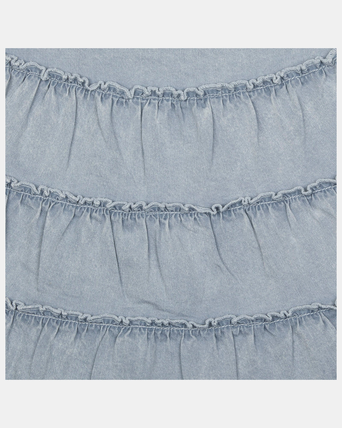 Close-up of the frill-edged tiers on the Indiana dress