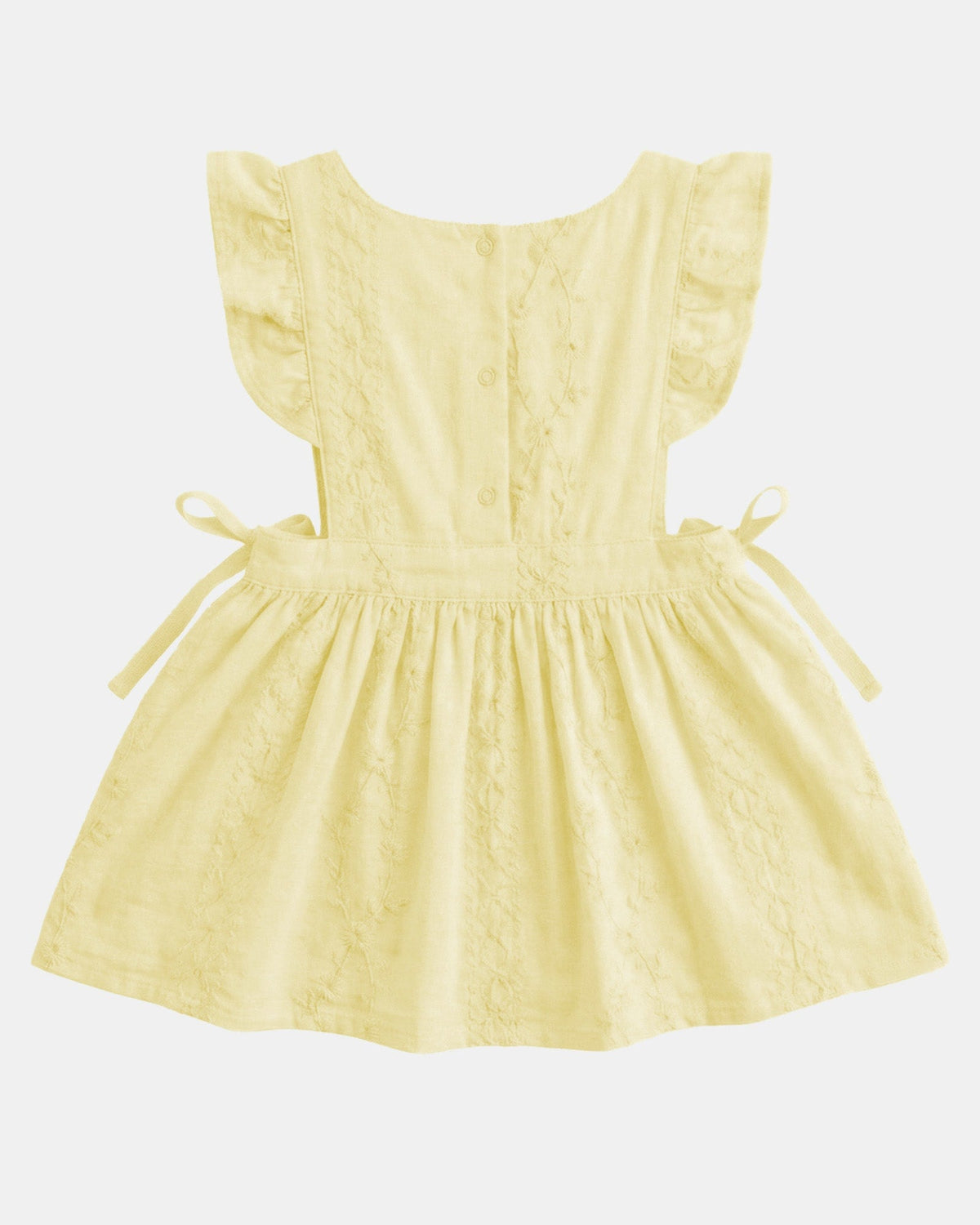 Back of the lemon Florence pinafore showing the frilled straps, the fastening down the back and the side ties