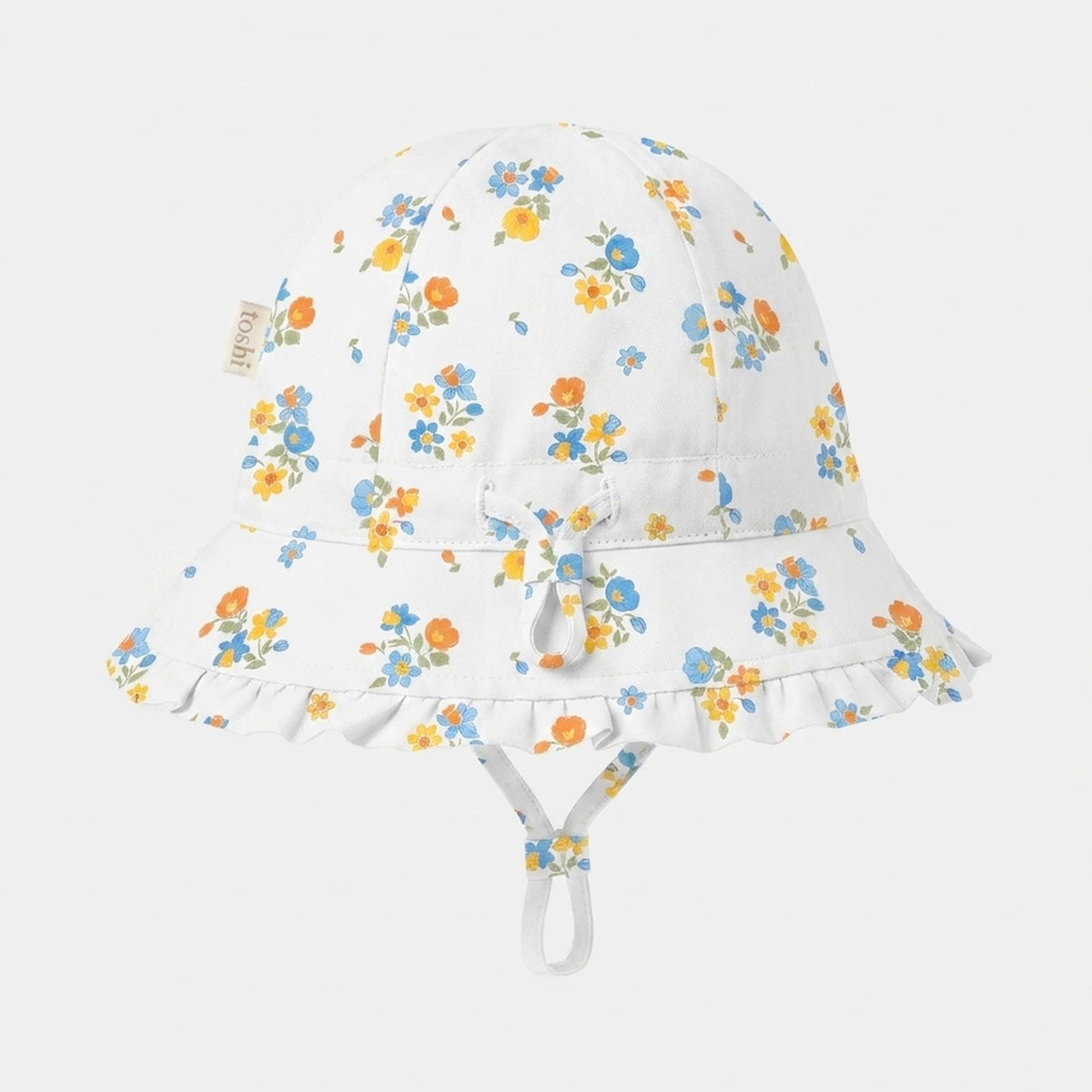 Toshi Arcadia Maddie Vanilla bell sunhat in white cotton with small blue, orange and yellow flowers, frilled brim, adjustable head toggle and chin strap