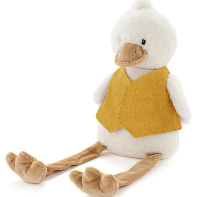 Cream plush duck with long dangly legs, sitting in a plain mustard linen bib.