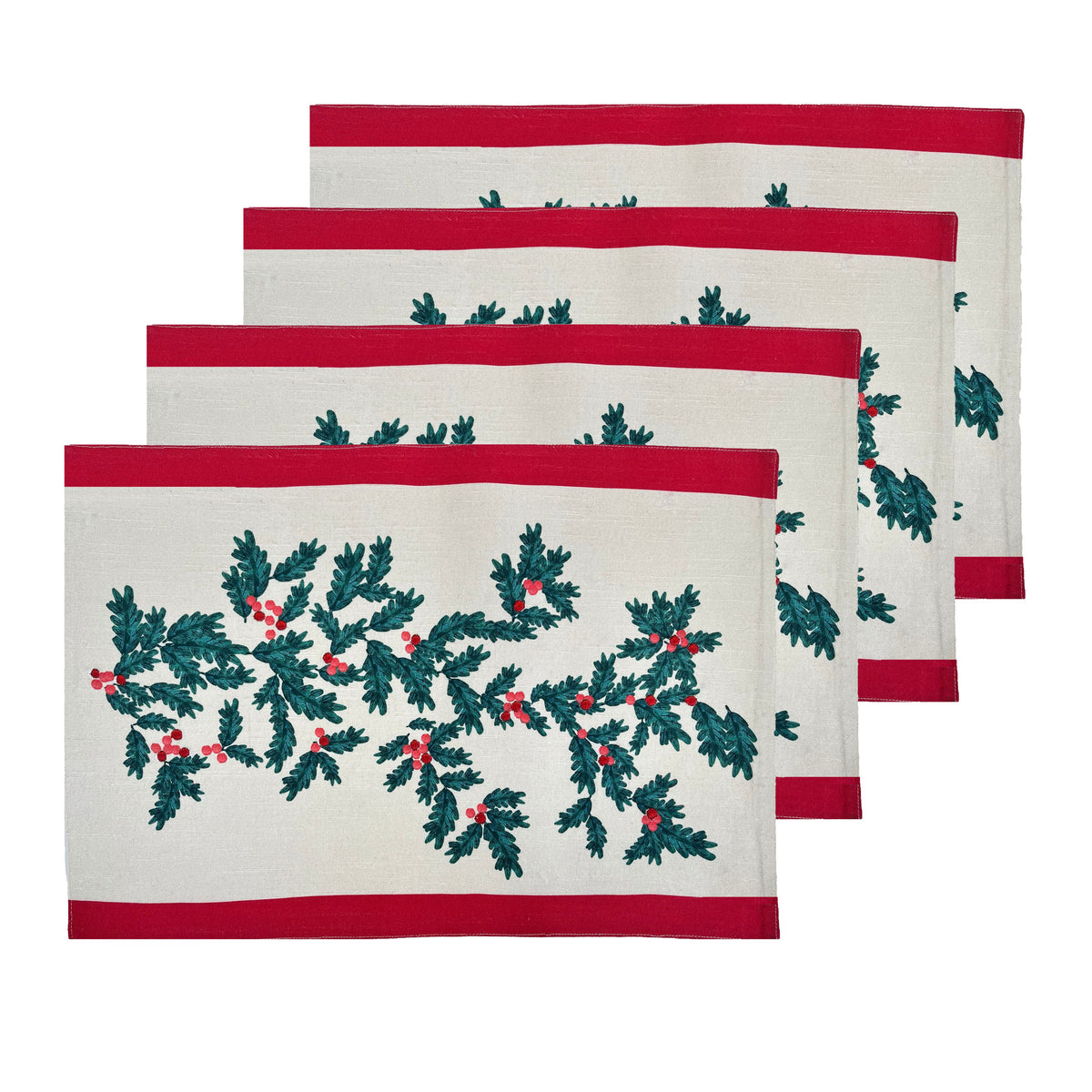 Four Christmas Foliage cotton placemats fanned in a stack, green leaves and red berries on white with red stripes