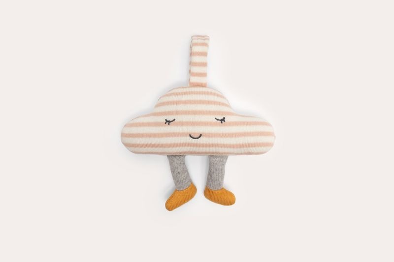 Knitted cloud in pink and cream stripes with a stitched sleepy face, grey legs and mustard feet, hanging from a knitted tab.