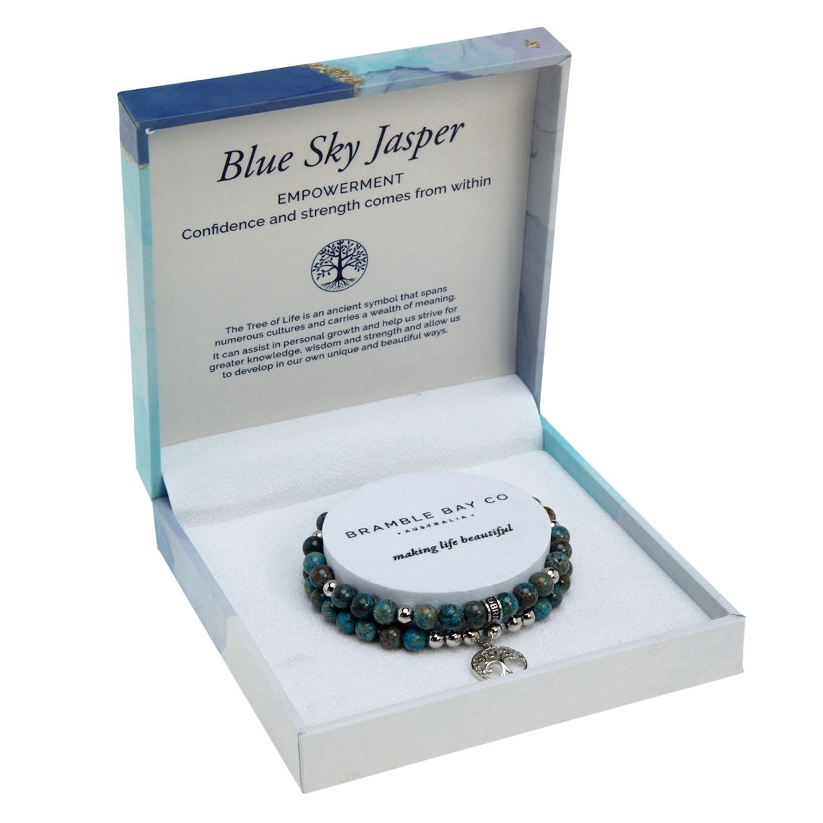 Two blue sky jasper bead bracelets with silver spacers and a Tree of Life charm, in an open blue marble gift box