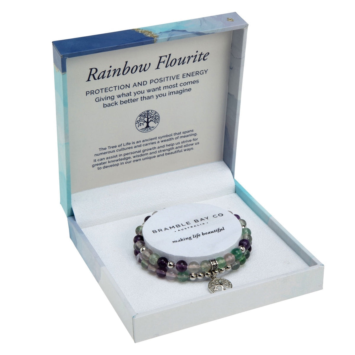 Two rainbow fluorite bead bracelets in purple, green and clear with silver spacers and a Tree of Life charm, in an open blue marble gift box