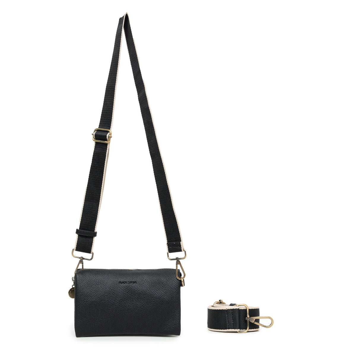 The black bag on its wide black cotton strap with cream edges.