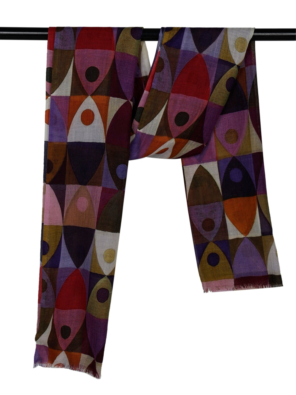 The geometric print scarf hanging over a rail, showing the purple, red and olive shapes