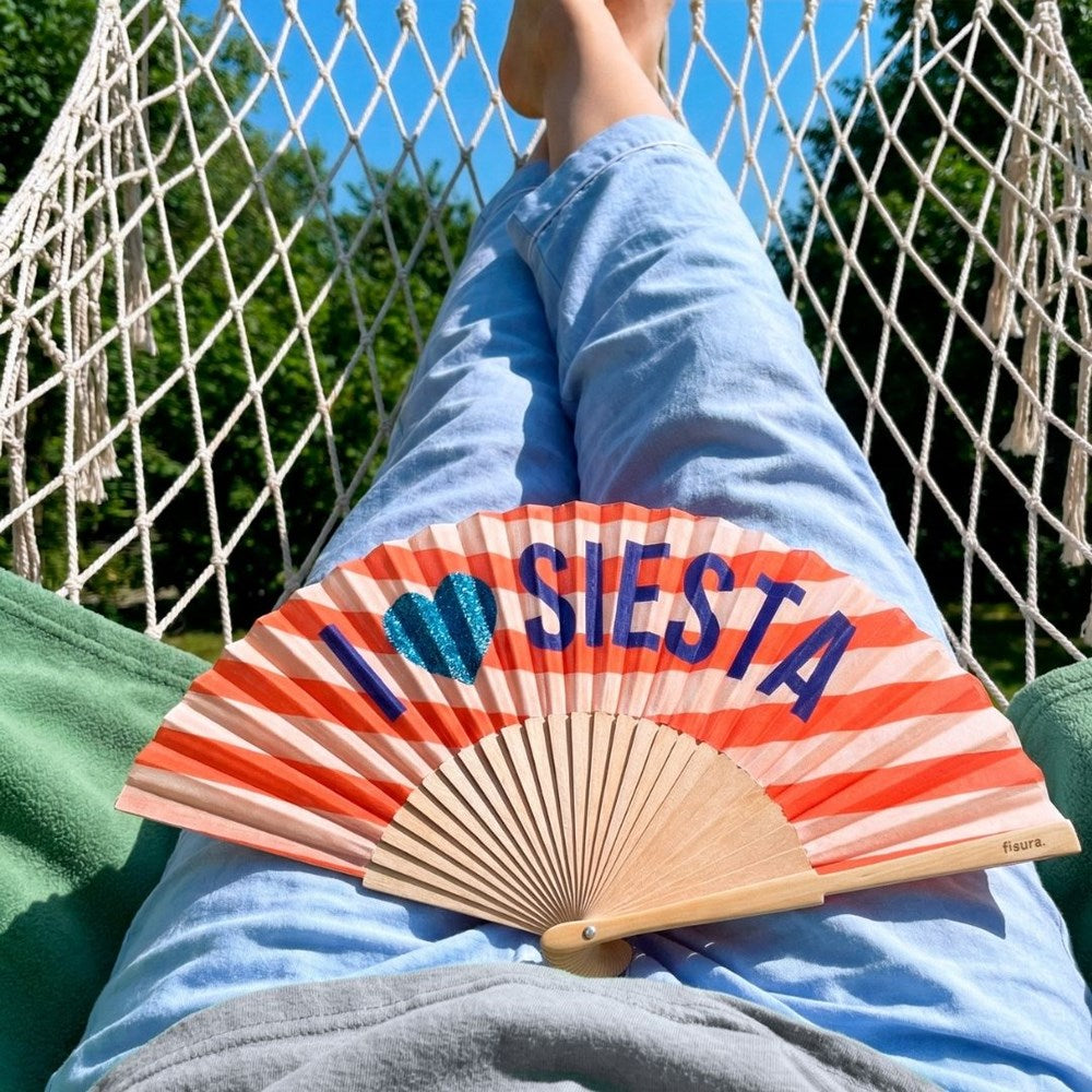 I love Siesta fan lying open across someone's lap in a hammock