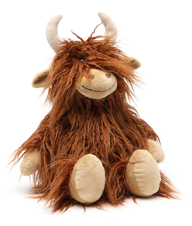 Plush Highland cow in long shaggy rust-coloured fur with cream horns and cream hooves, sitting facing forward.