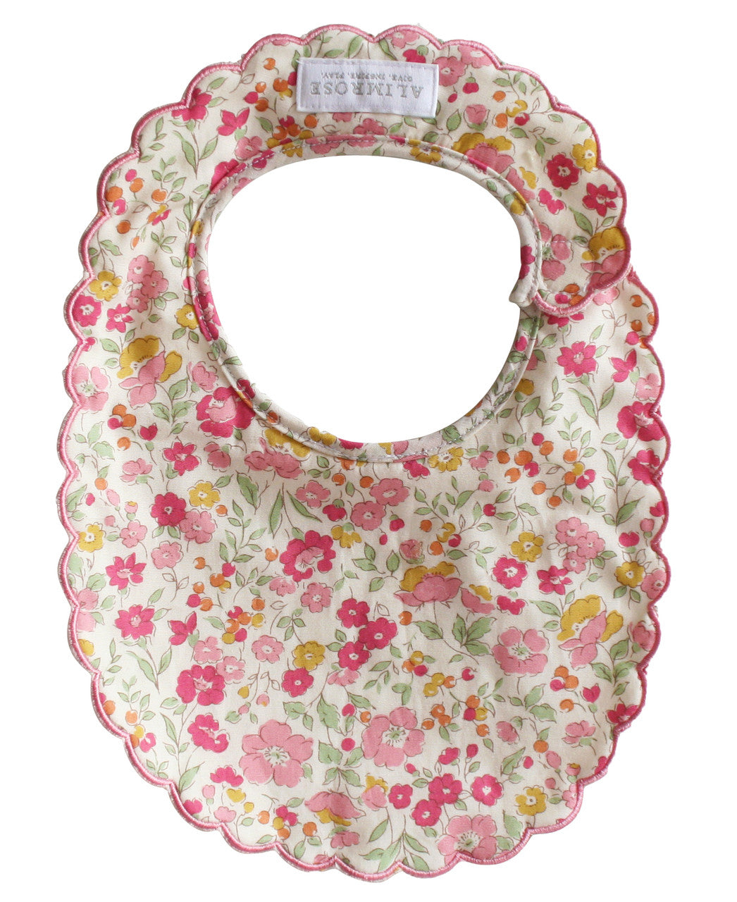 Back of the scallop floral bib showing the neck opening and fastening
