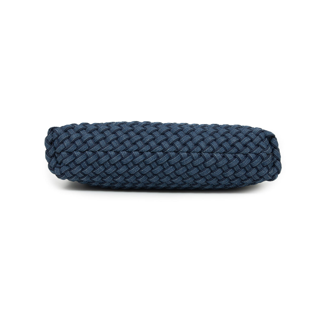 The woven bag from below, showing its flat woven base.
