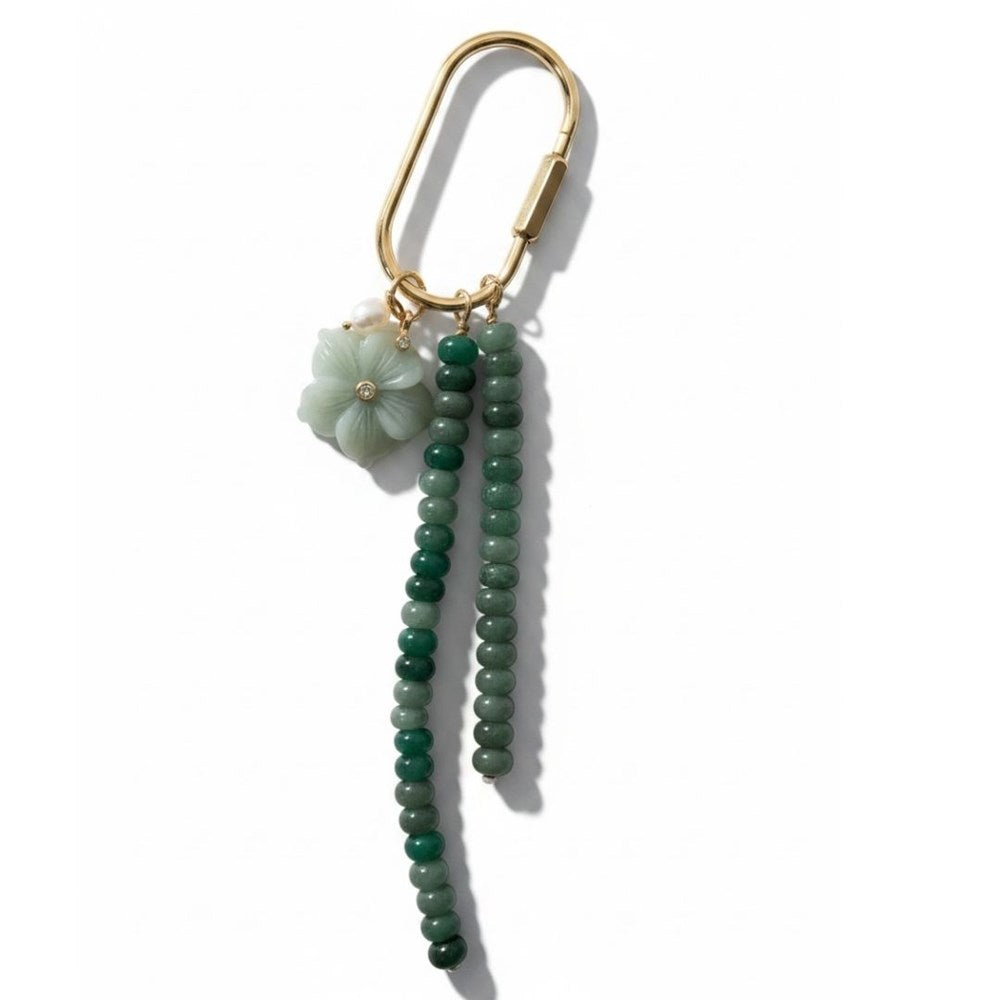Gold carabiner keyring with two strands of green stone beads and a pale green flower charm
