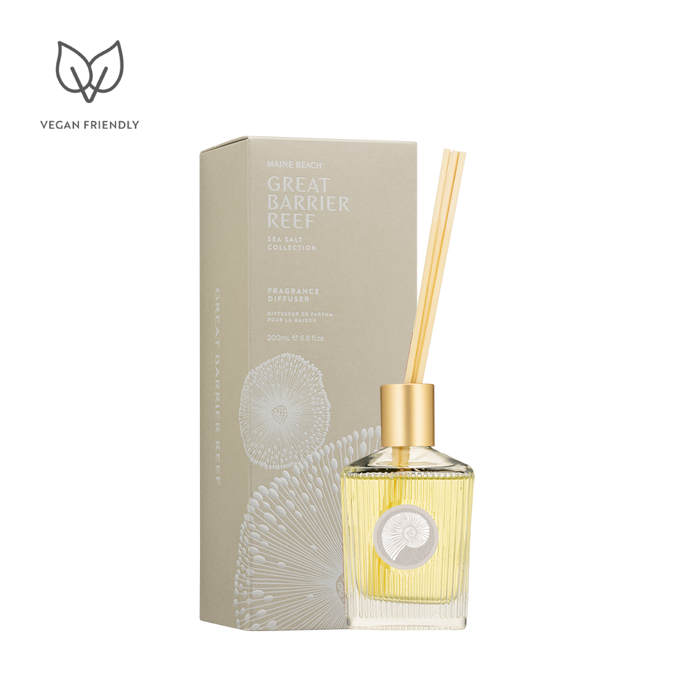 Great Barrier Reef Sea Salt Fragrance Diffuser in a glass bottle with a gold top and reeds, beside its box