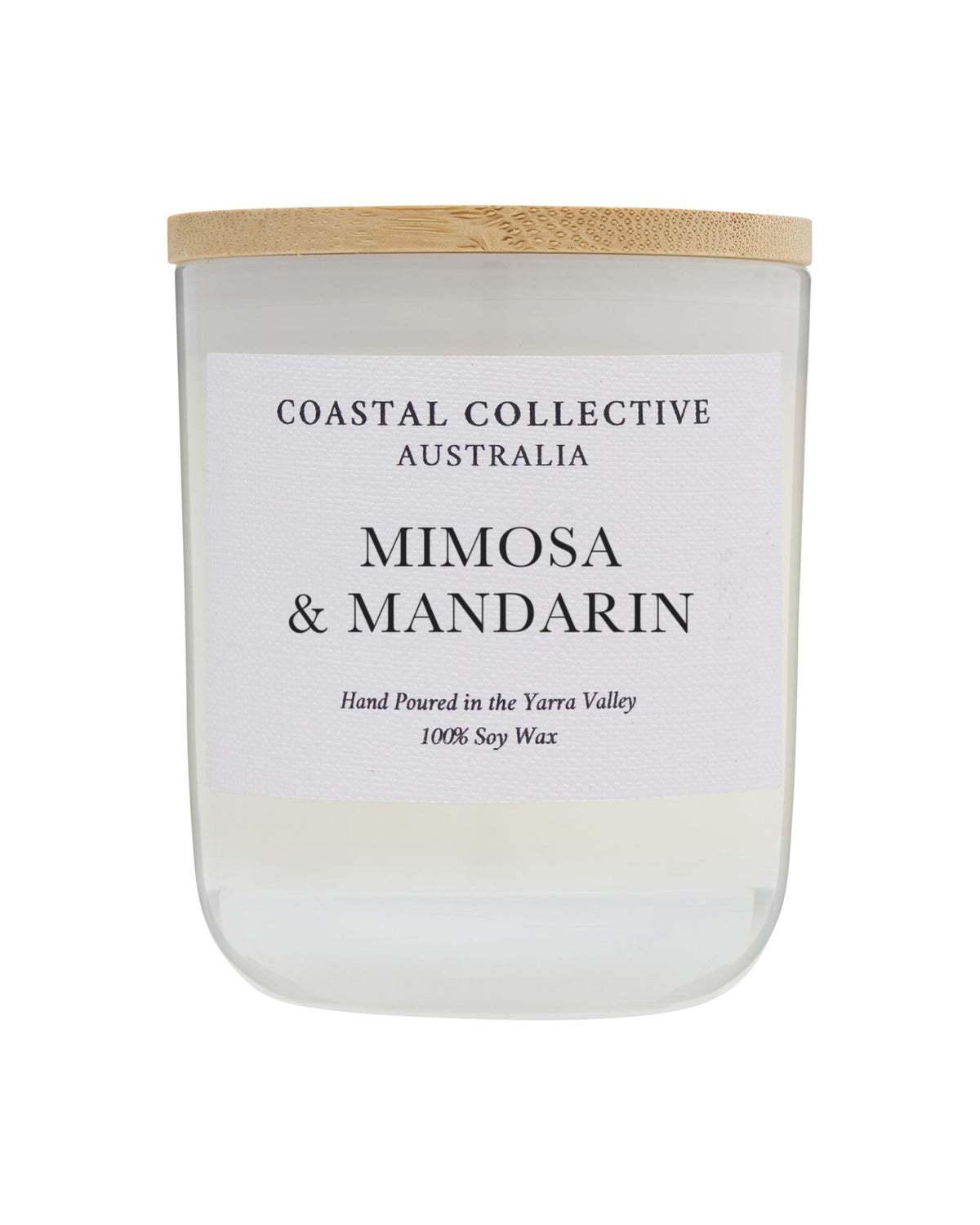 Mimosa & Mandarin candle in a taller frosted jar with a pale wooden lid.
