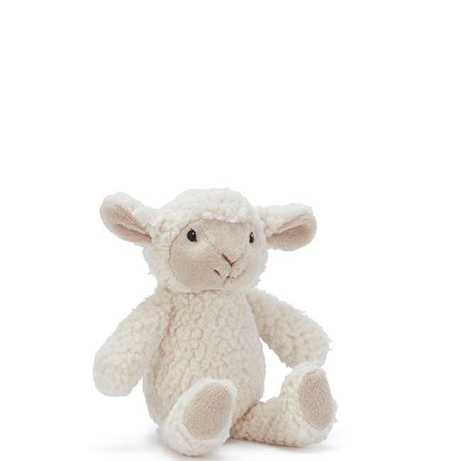 Small cream plush sheep rattle with curly fur and pale ears, sitting with its legs out in front.