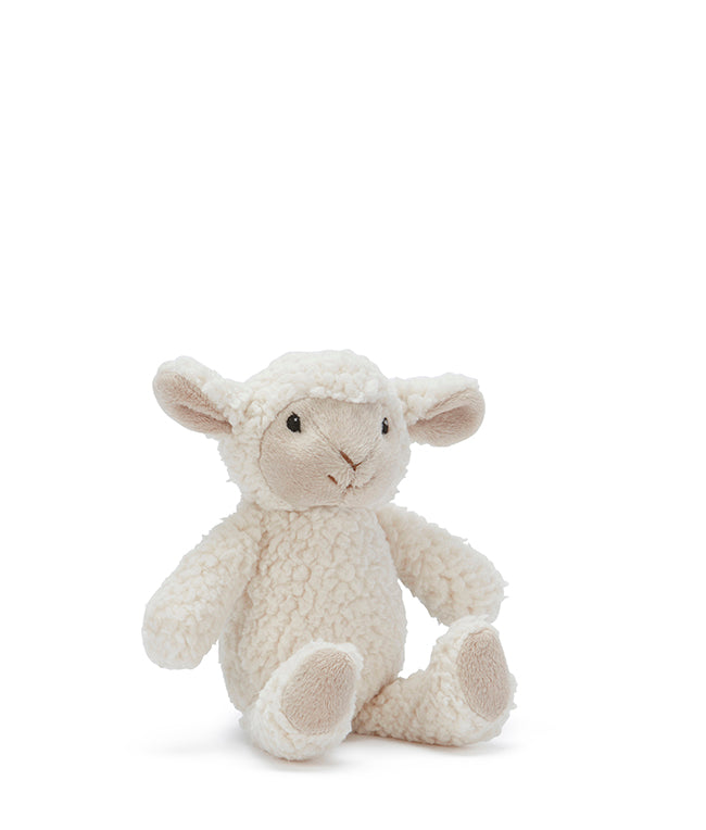 Small cream plush sheep rattle with curly fur and pale ears, sitting with its legs out in front.