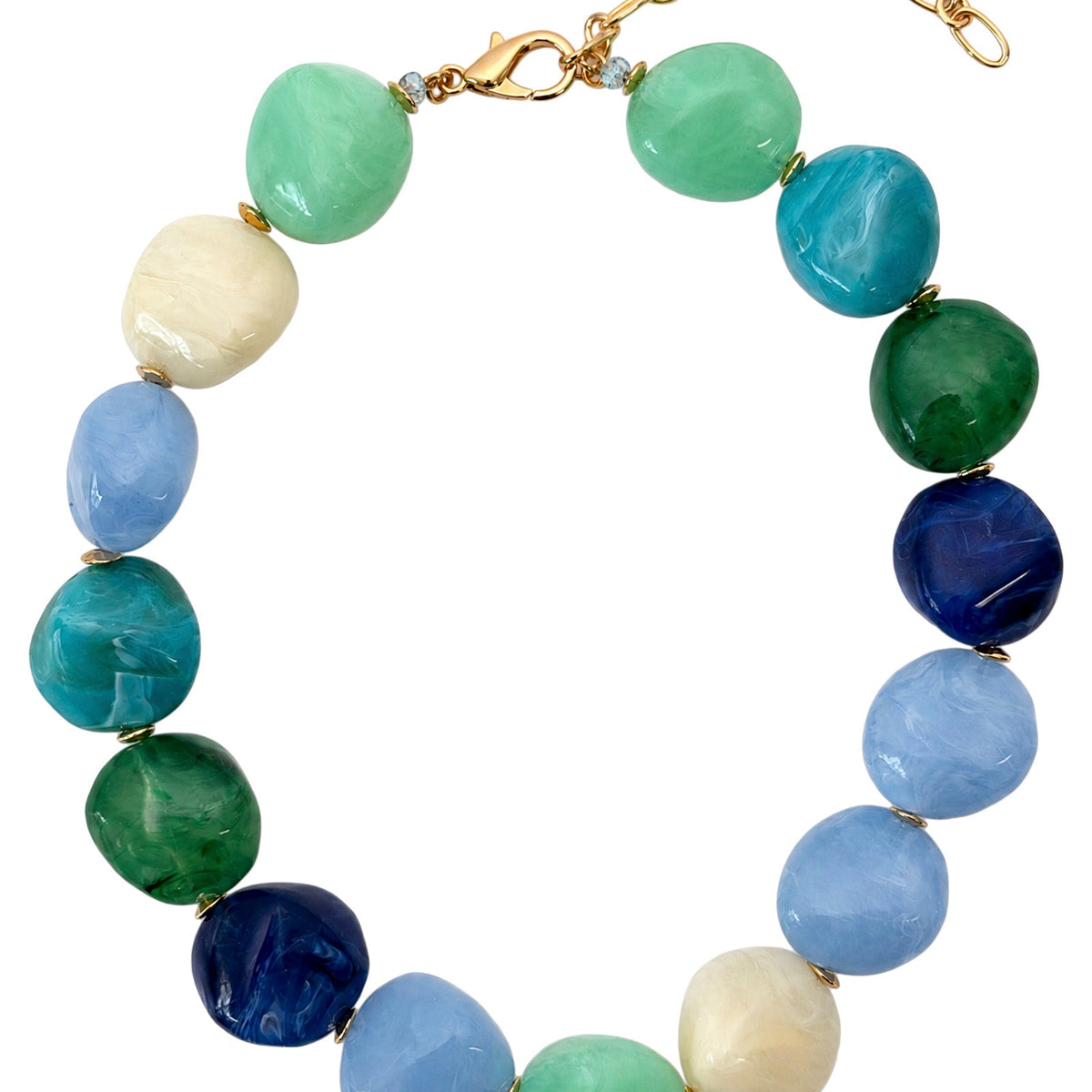 Palmera Seafoam necklace laid flat: marble-look beads in light blue, navy, teal, mint, emerald and cream on a gold-tone clasp and chain