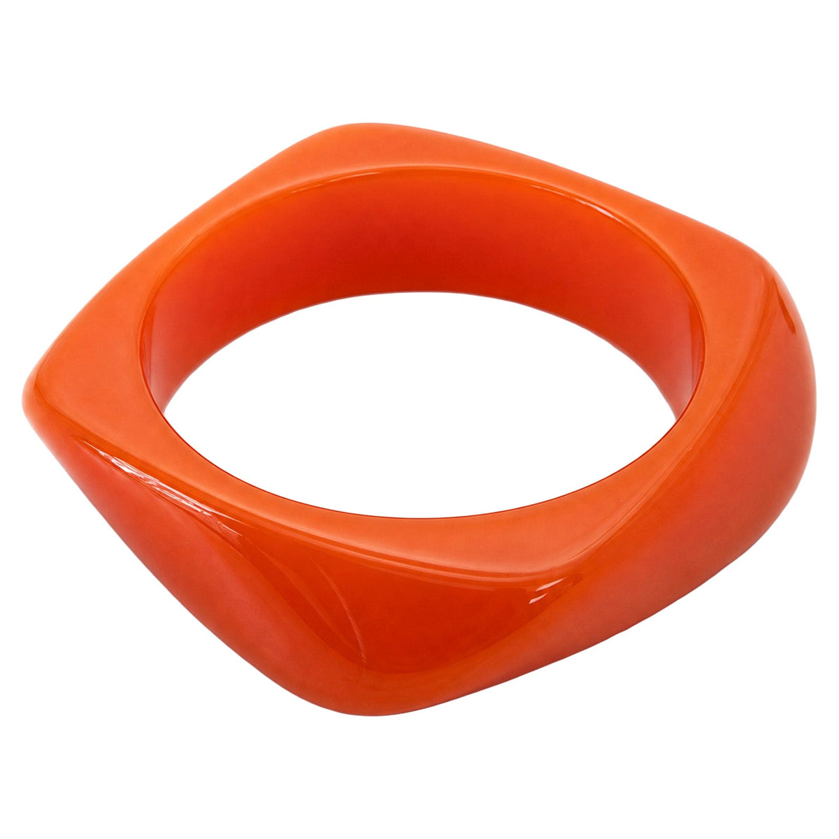 Palmera Sunset bangle: a chunky bright orange bangle with a softly squared profile