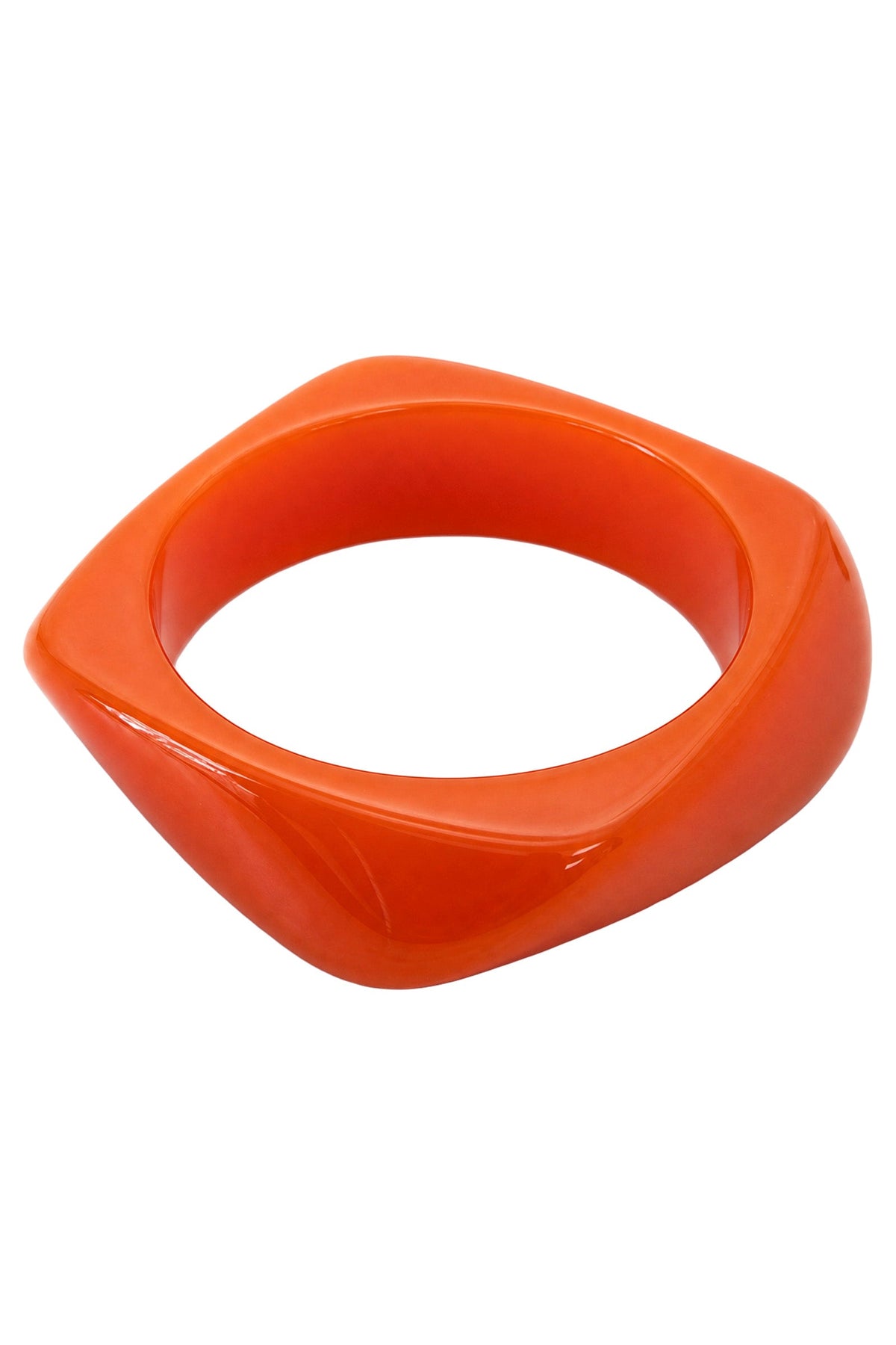 Palmera Sunset bangle: a chunky bright orange bangle with a softly squared profile