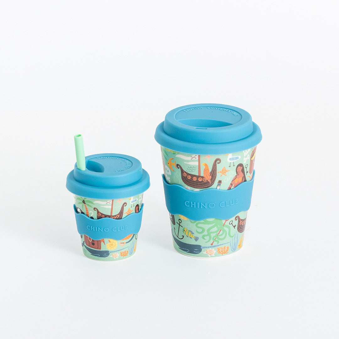 Pirate babychino cup beside a larger pirate-print cup, which is not included