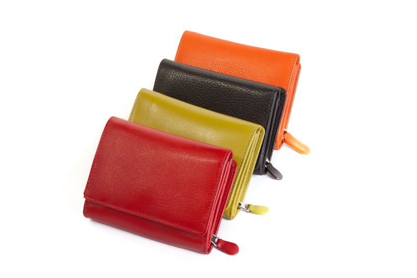Red, lime, black and orange wallets stacked in a fan, flaps closed