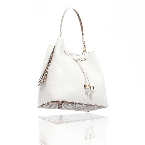 White Ruby bucket bag with snakeskin-print side tassels, a snakeskin-print base and gold-tone hardware