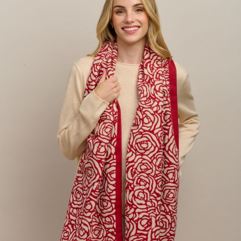 Model wearing the red Wild Rose scarf with a cream knit