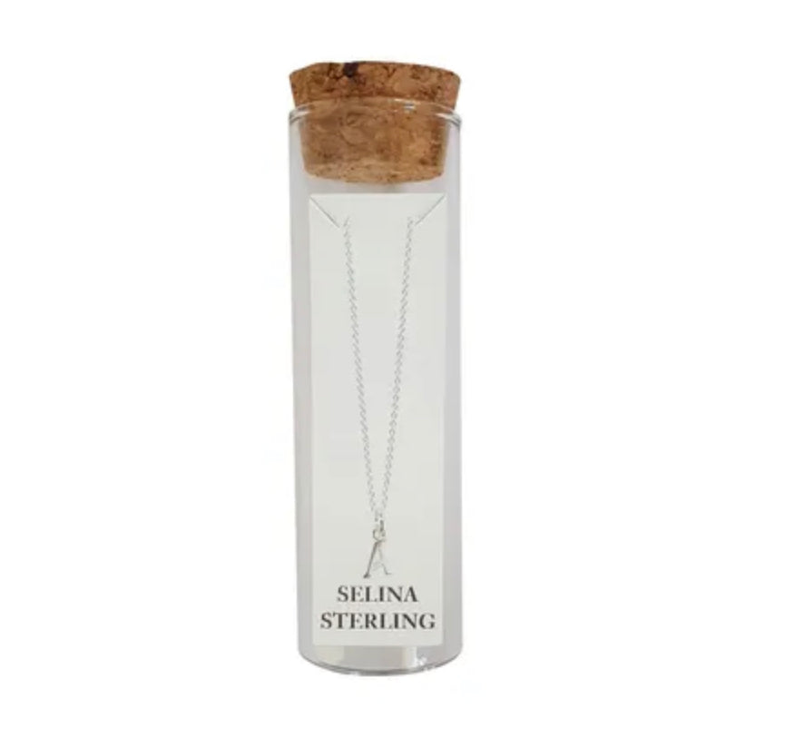 Selina sterling silver letter A initial necklace in its cork-topped glass gift tube