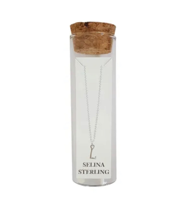 Selina sterling silver letter L initial necklace in its cork-topped glass gift tube