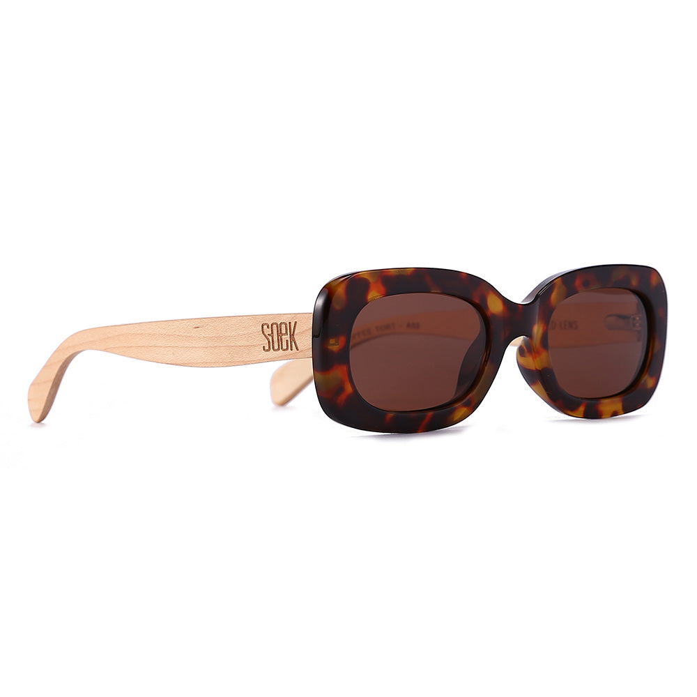 Vibe sunglasses at an angle, showing the pale maple wood arms