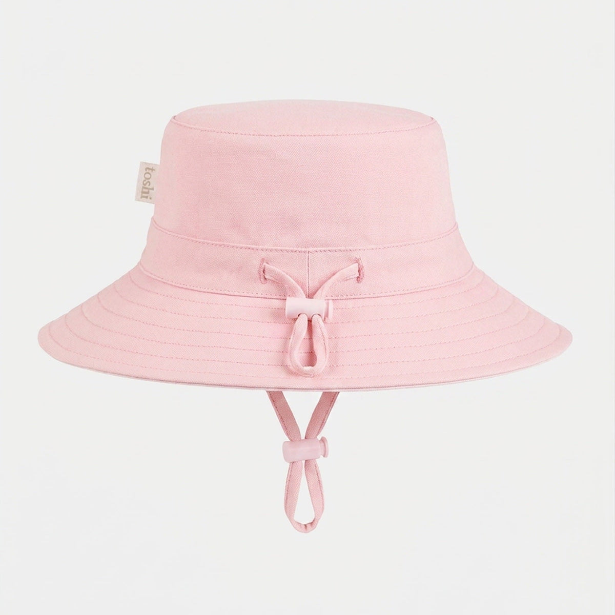 Toshi Olly bucket sunhat in plain soft pink with its adjustable head toggle and chin strap