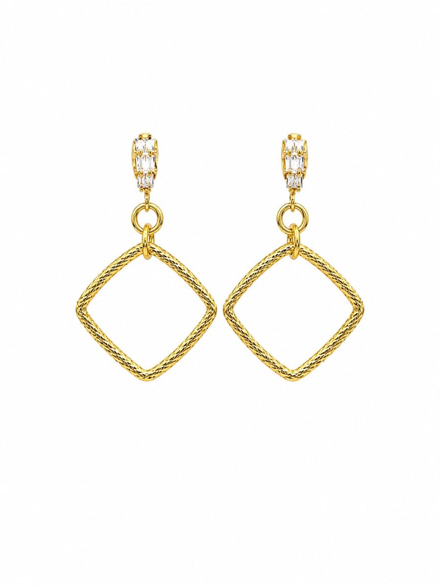 Pair of drop earrings with an open textured gold-tone square hanging on its point from a sparkling stud