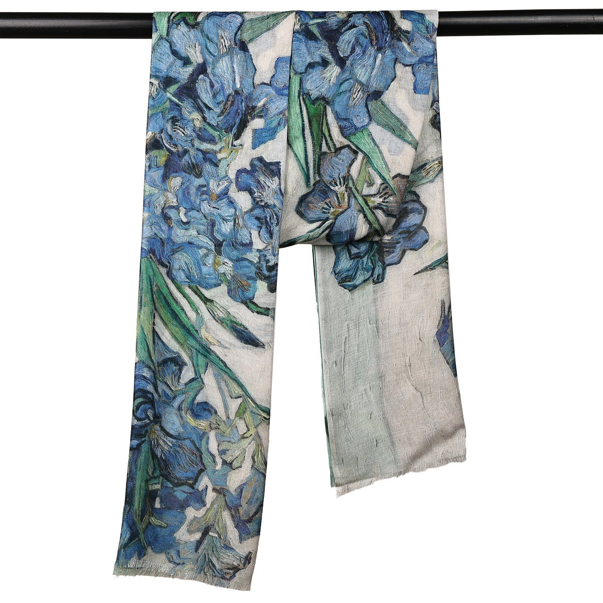 The Irises scarf hanging over a rail, showing the blue flowers along its length