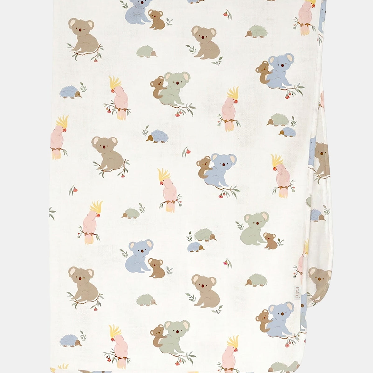 Toshi Arcadia Gumnut Babies muslin wrap in white cotton printed with koalas, cockatoos and echidnas, folded