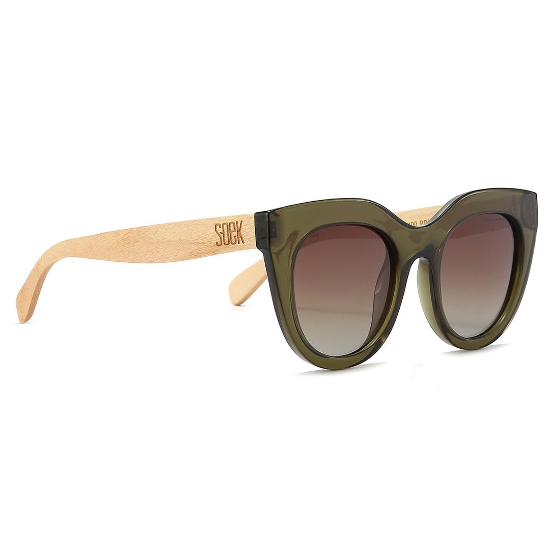 Milla Khaki sunglasses at an angle: a chunky olive green cat-eye frame, brown gradient lenses and pale maple arms