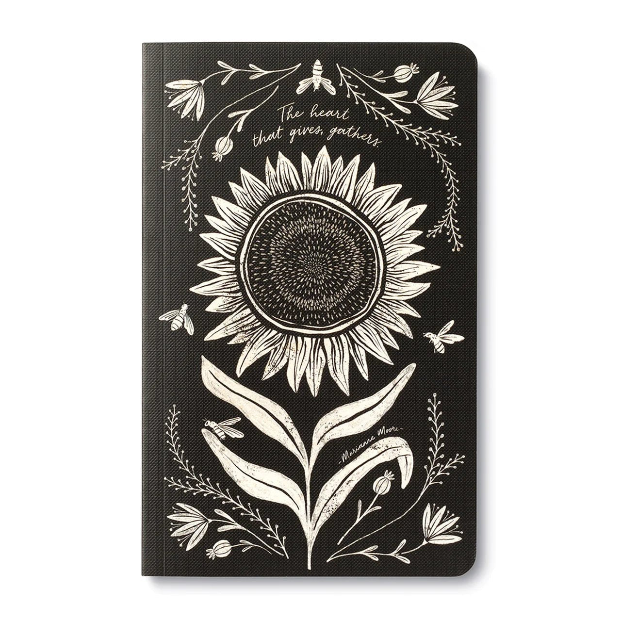 Black journal cover with a white line-drawn sunflower and the words the heart that gives, gathers