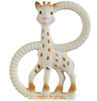 Sophie la Girafe standing inside a large cream rubber ring teether, her tan spots visible and her name embossed at the base.