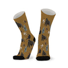 Pair of warm tan socks with black toes, printed with gorillas, apes and monkeys in grey and brown.