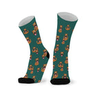Pair of deep forest green socks with black toes, printed with tan boxer dogs with their ears up.