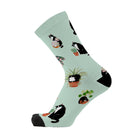 Single mint green sock shown side-on, with a black-and-white cat and a potted fern in the print.