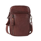Brown cross body bag from the front, a warm reddish brown with zip pockets on the front