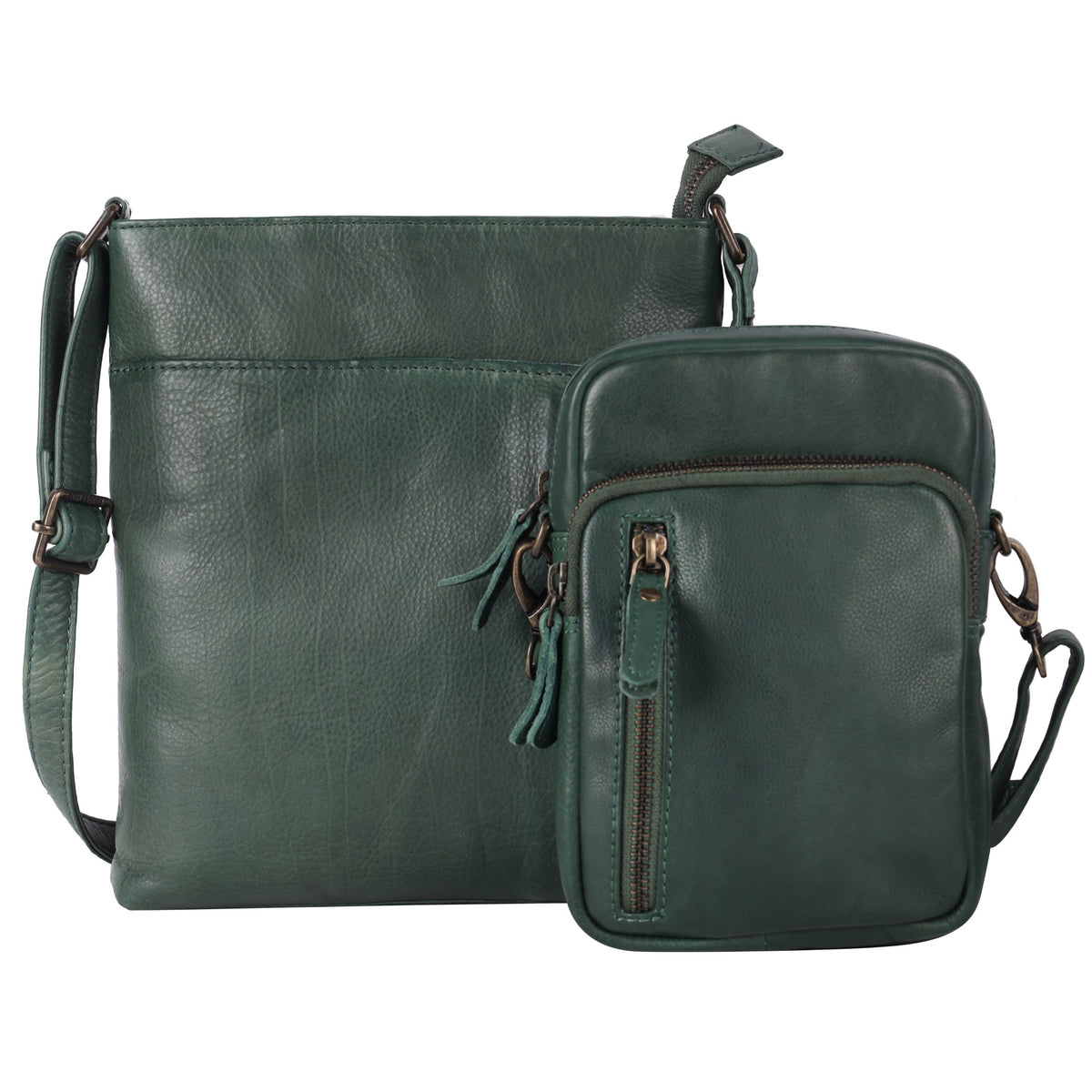 Pine green cross body bag in front of a larger bag in the same green leather