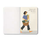 Open journal with lined pages beside an illustration of a woman carrying a basket of groceries