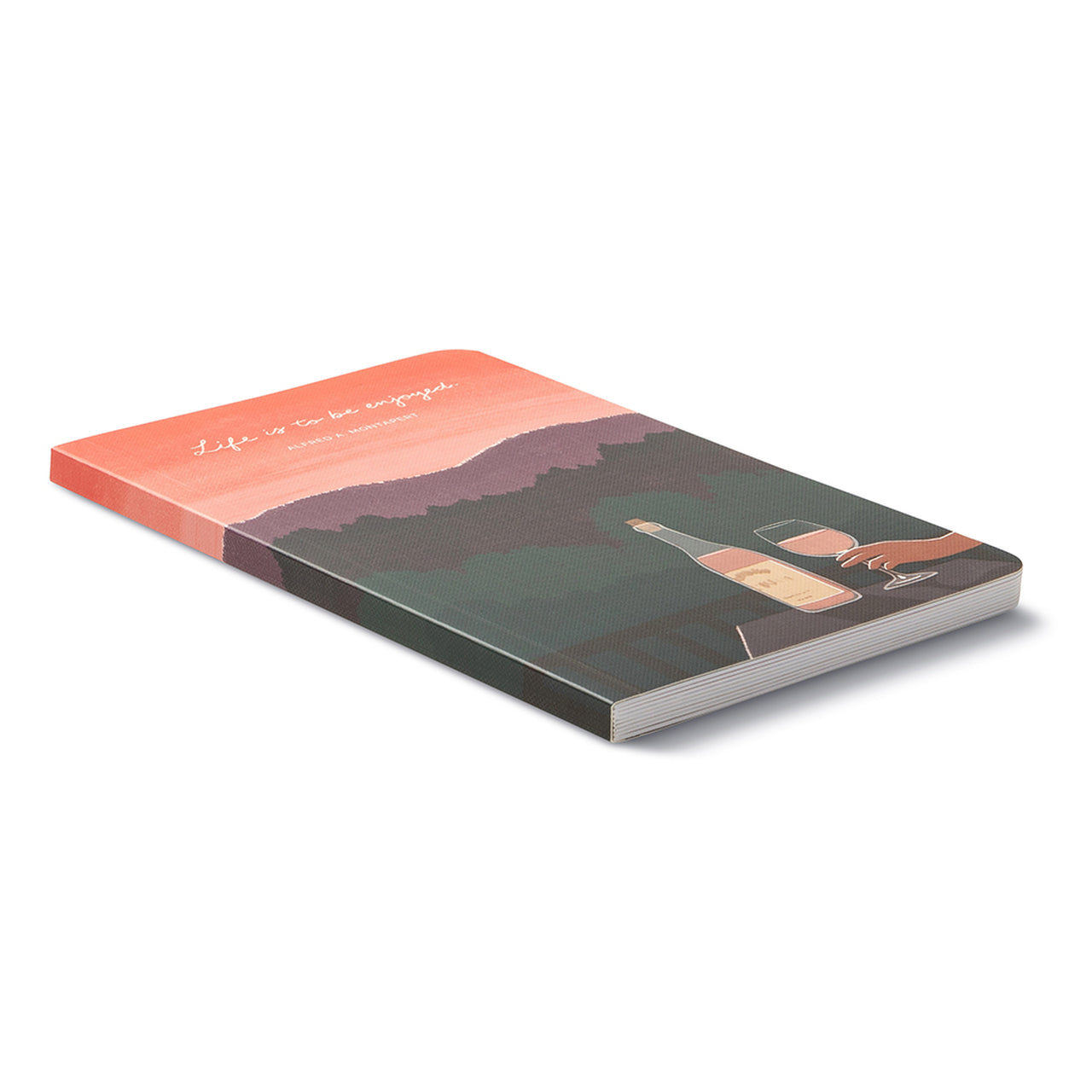 Angled view of the sunset softcover journal lying closed