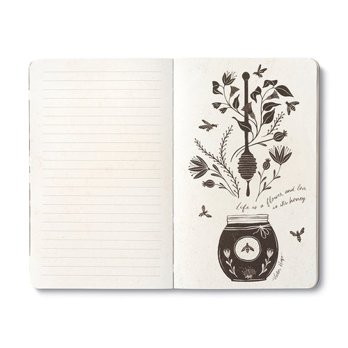 Open journal with lined pages beside a cream page of a honey pot and dipper among flowering stems and bees, lettered: life is a flower and love is its honey