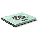 Angled view of the mint green hardcover lying closed