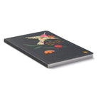 Angled view of the softcover hummingbird journal lying flat