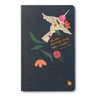 Dark grey journal cover with a folk-art hummingbird and the words: we can begin by doing small things