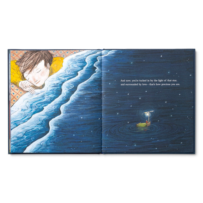 Open spread of a sleeping child beside a moonlit shoreline