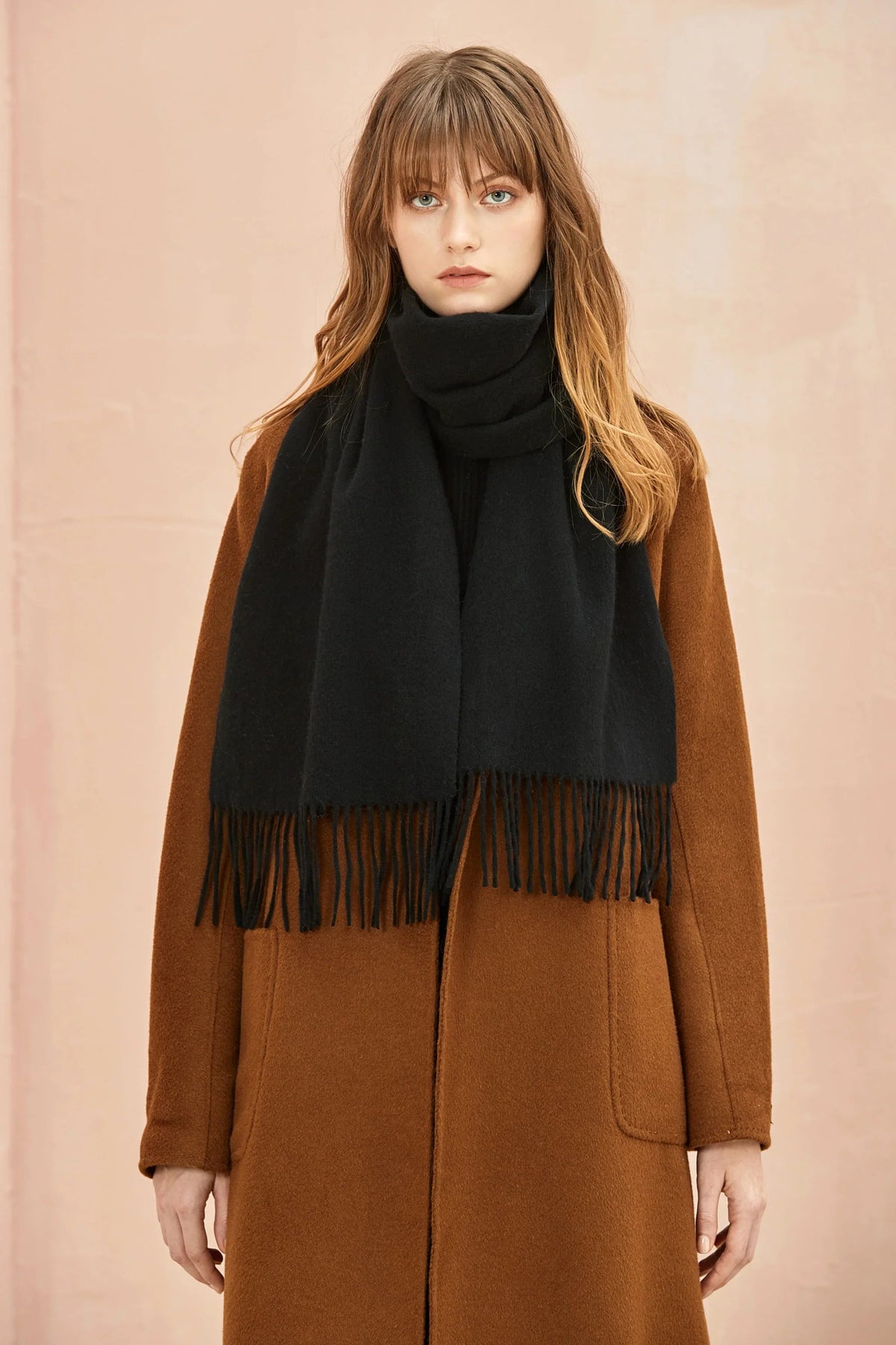 Close view of the Ebony black scarf over a brown coat