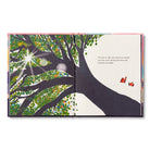 Open spread of a sunlit green tree beside its bare dark counterpart, with two small red birds